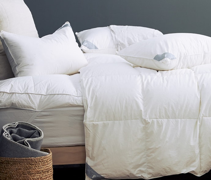 Bed with pillows, duvet inner and mattress protector