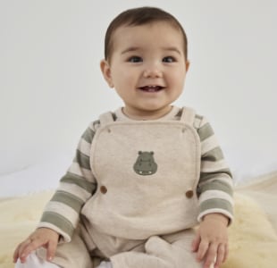 Image of baby wearing clothing from the nursery sale