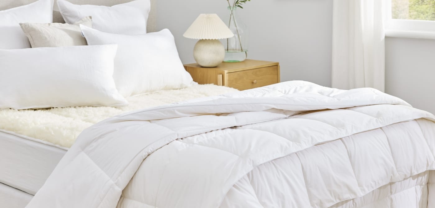 A selection of duvet inners displayed on a bed for the Manchester Duvet Inner Buying Guide