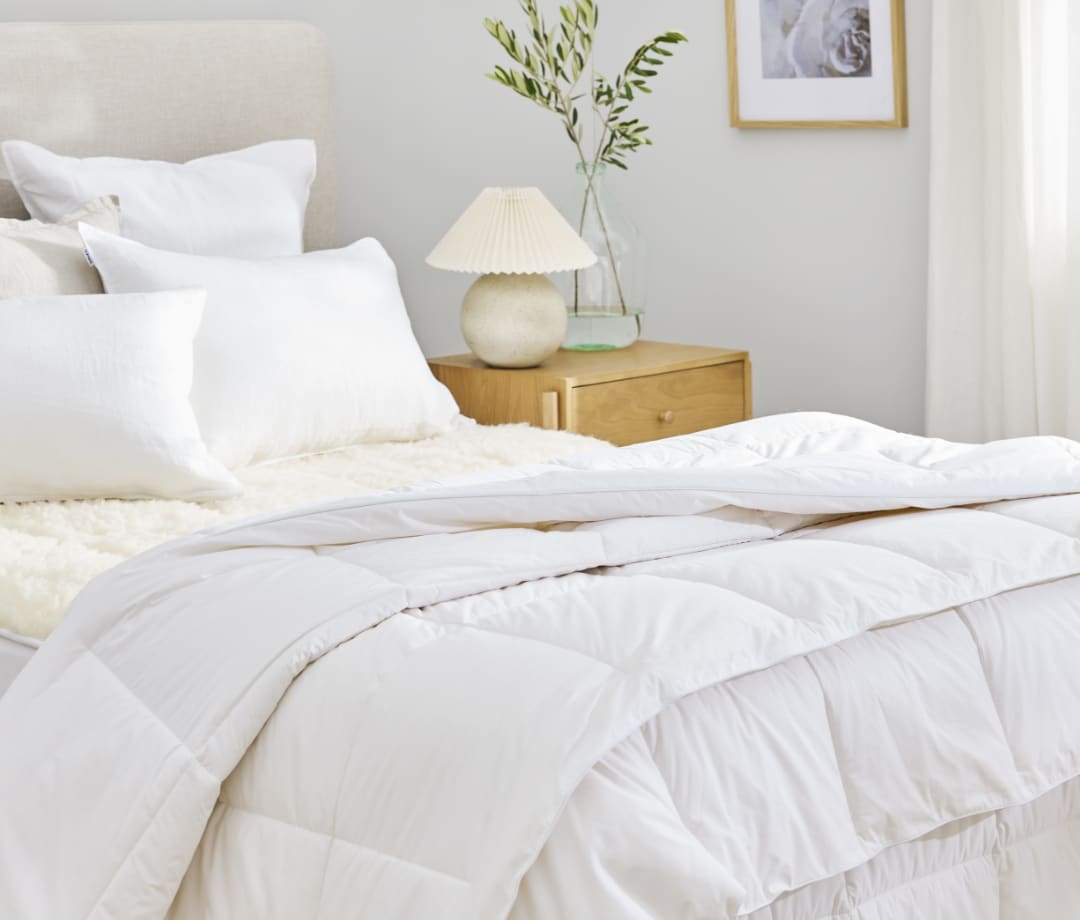 A selection of duvet inners displayed on a bed for the Manchester Duvet Inner Buying Guide