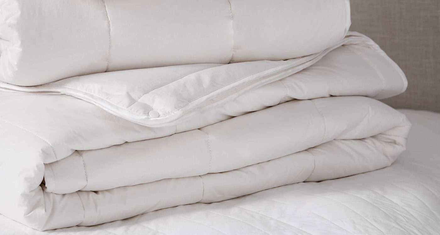 A goose feather and down duvet inner displayed on a bed for the Manchester Duvet Inner Buying Guide