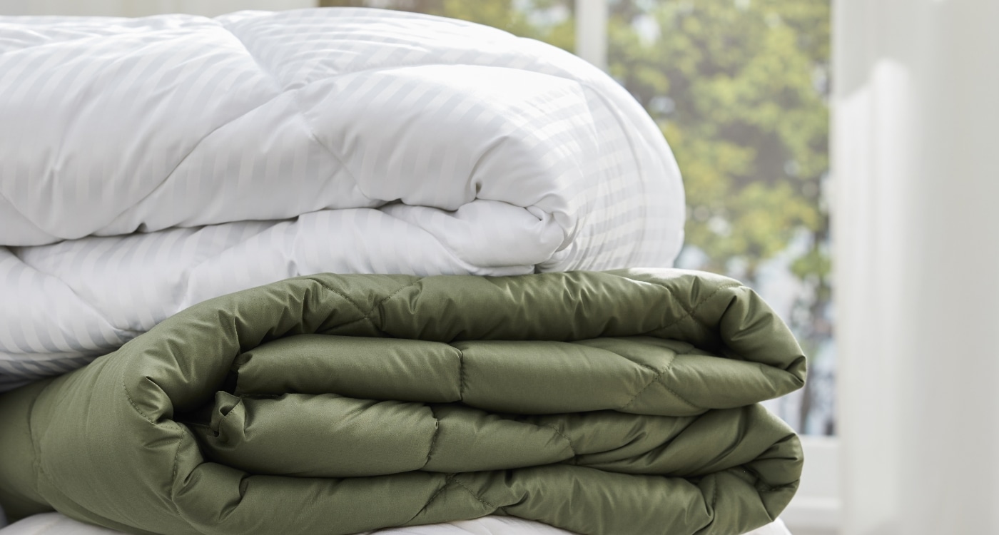 A polyester fibre duvet inner displayed on a bed for the Manchester Duvet Inner Buying Guide